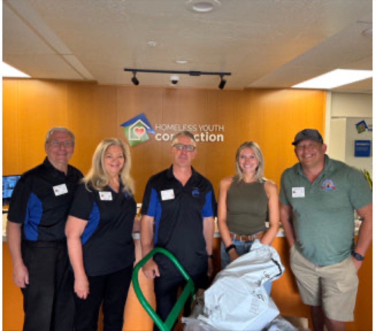 Elks volunteers delivering donations at the Homeless Youth Connection office